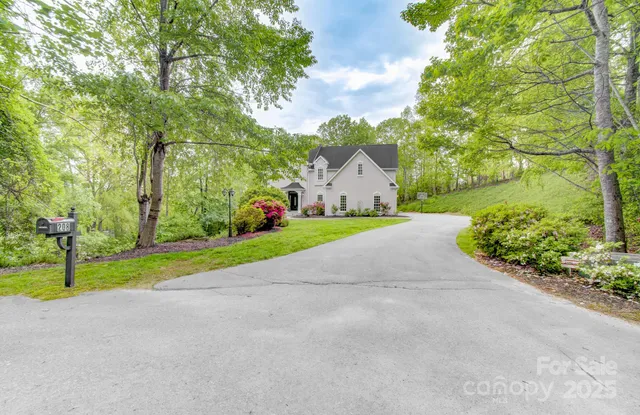 a view of a house with basketball court