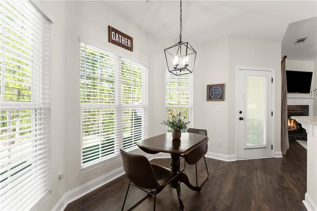 179 Prime Drive Commerce, GA 30530 - Photo 13 of 44 a view of a dining room with furniture window and wooden floor