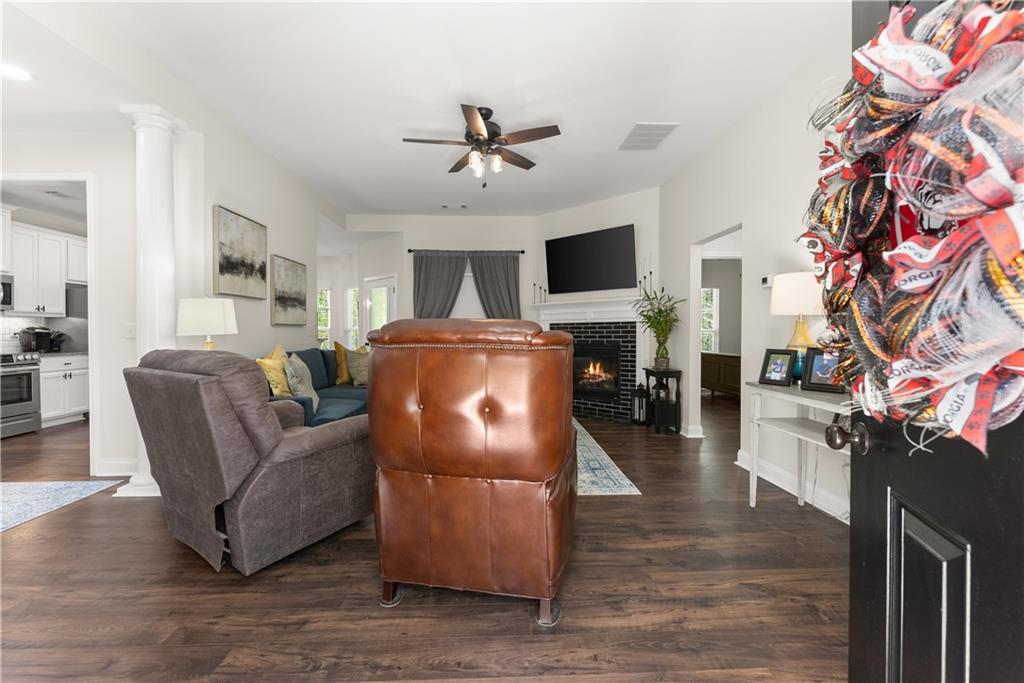 179 Prime Drive Commerce, GA 30530 - Photo 16 of 44 a living room with furniture a flat screen tv and a fireplace