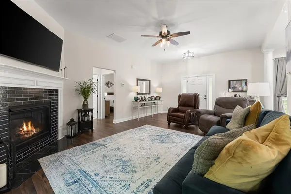 a living room with furniture and a fireplace