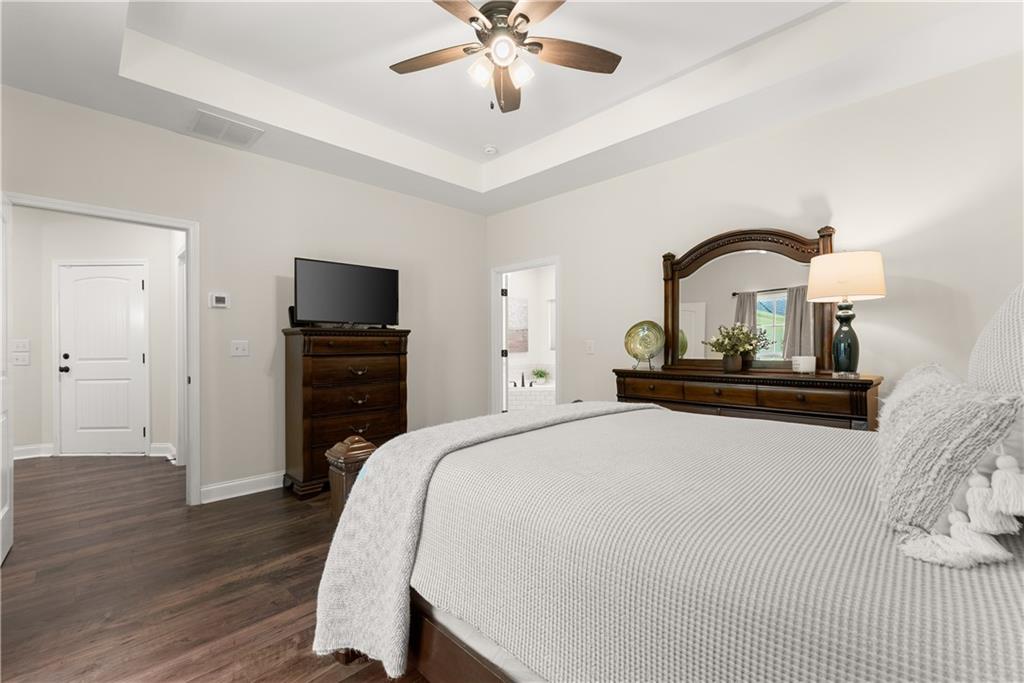 179 Prime Drive Commerce, GA 30530 - Photo 23 of 44 a bedroom with a bed and a flat screen tv