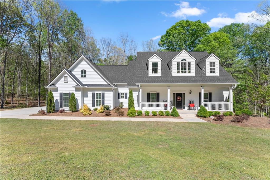 179 Prime Drive Commerce, GA 30530 - Photo 4 of 44 a front view of a house with a yard