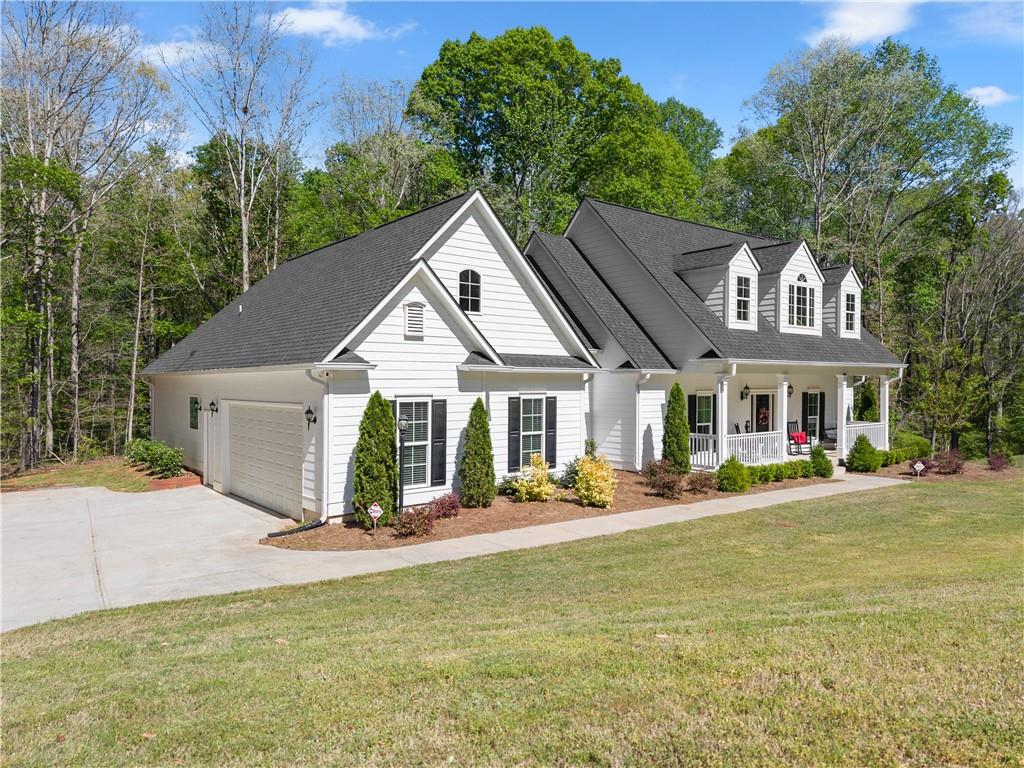 179 Prime Drive Commerce, GA 30530 - Photo 5 of 44 a front view of a house with a yard