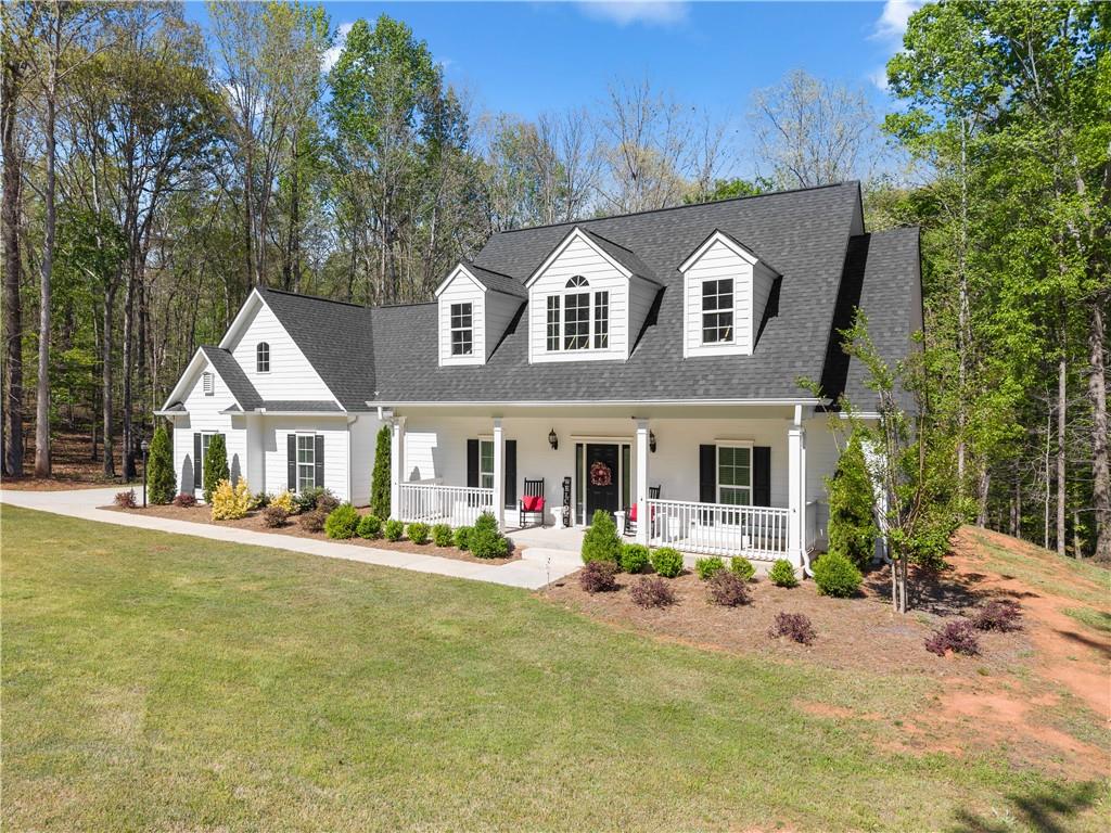 179 Prime Drive Commerce, GA 30530 - Photo 6 of 44 a front view of a house with garden