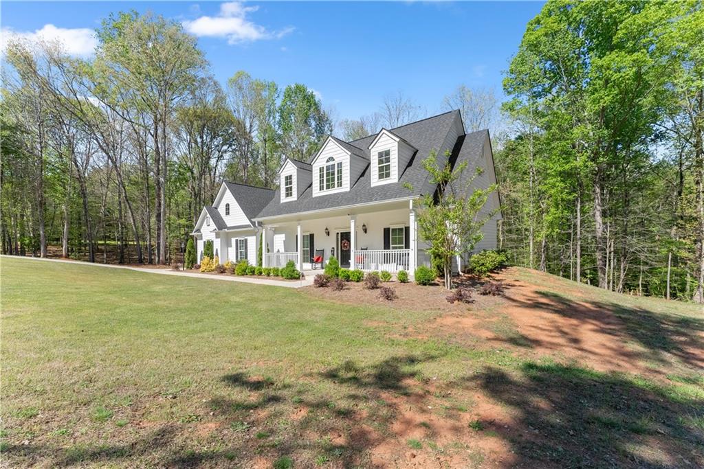 179 Prime Drive Commerce, GA 30530 - Photo 7 of 44 a front view of house with yard and seating area