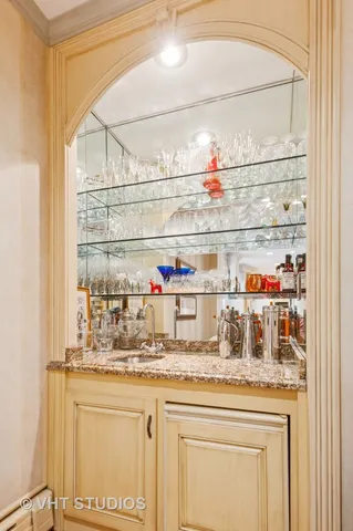 a kitchen with stainless steel appliances granite countertop a sink and cabinets