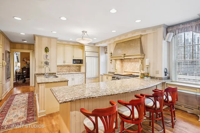 a large kitchen with lots of counter space and windows