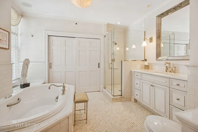 a spacious bathroom with a sink double vanity shower and a bathtub