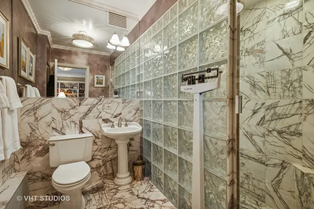 a bathroom with a sink and toilet