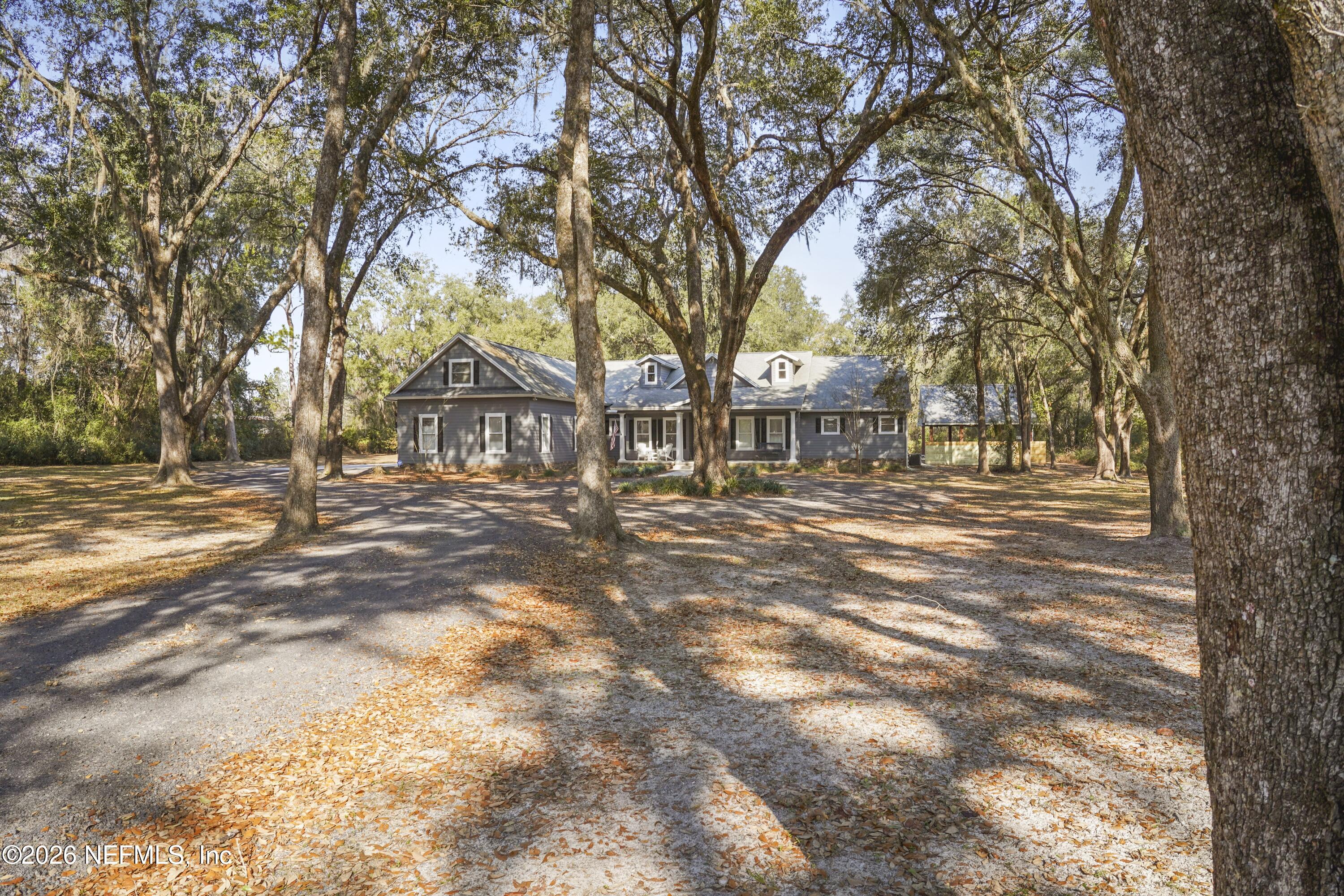 6153 Tim Crews Road Macclenny, FL 32063 - Photo 16 of 79 a view of road with trees