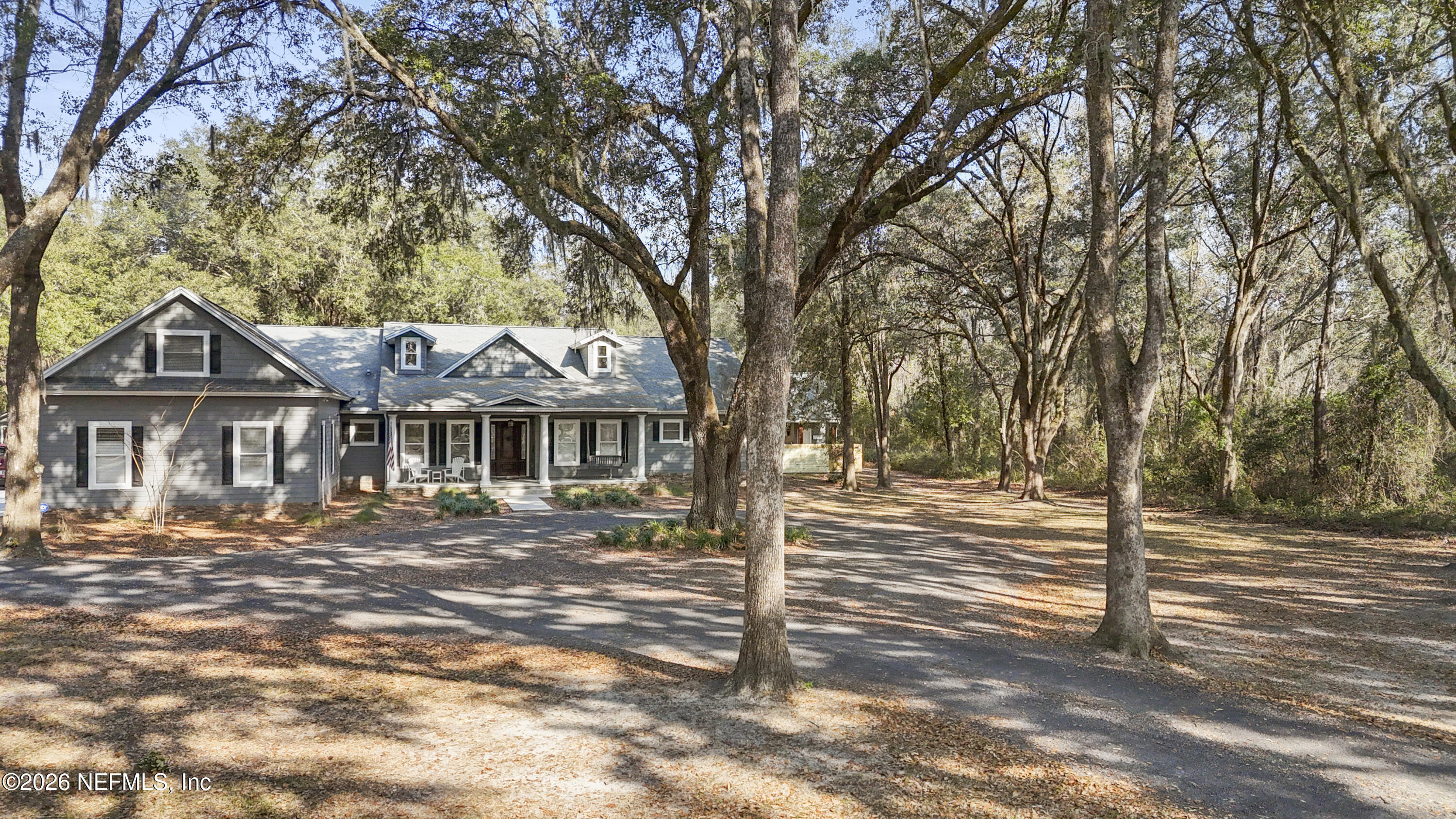 6153 Tim Crews Road Macclenny, FL 32063 - Photo 2 of 79 a view of a house with a yard