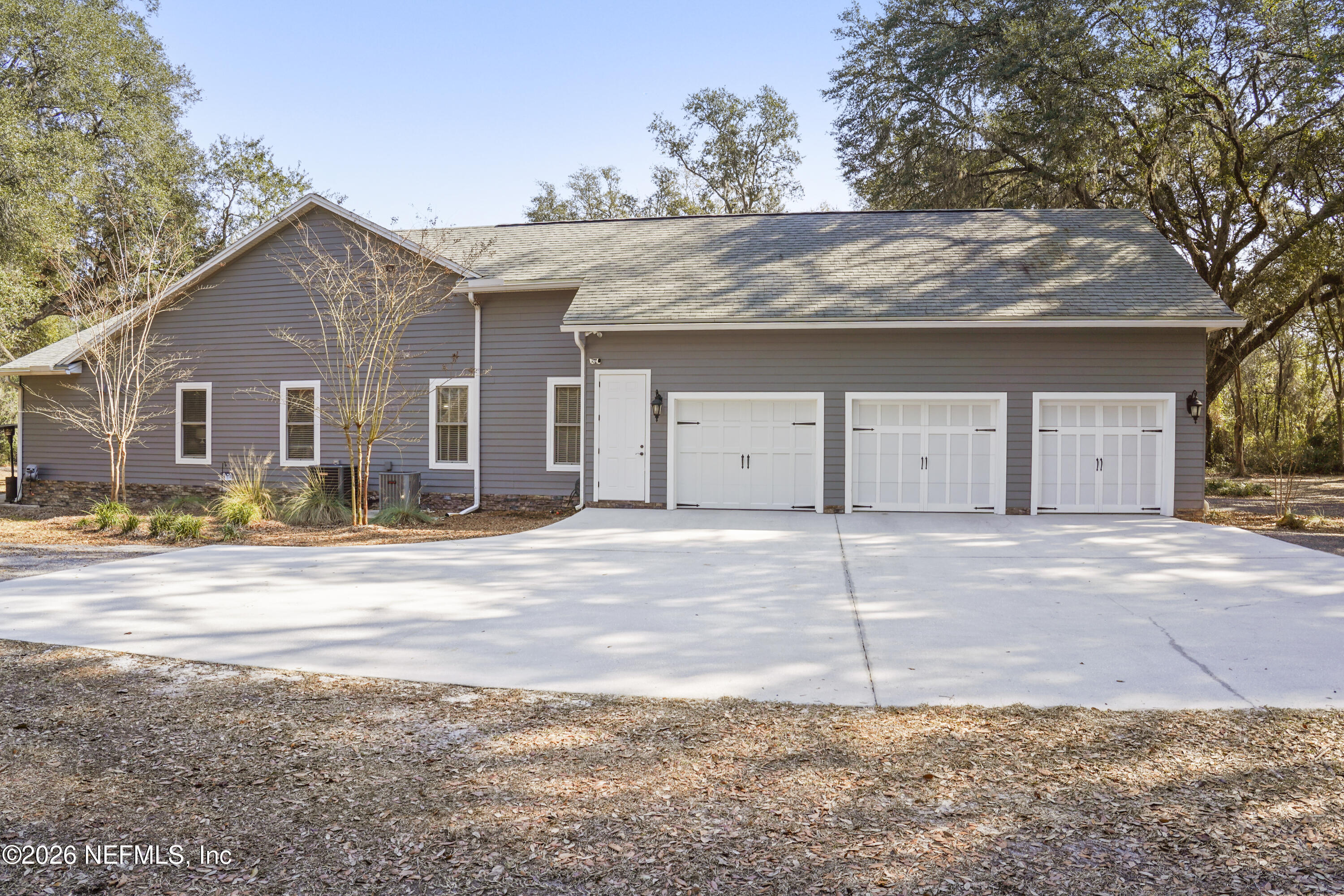 6153 Tim Crews Road Macclenny, FL 32063 - Photo 22 of 79 a view of a house with a outdoor space