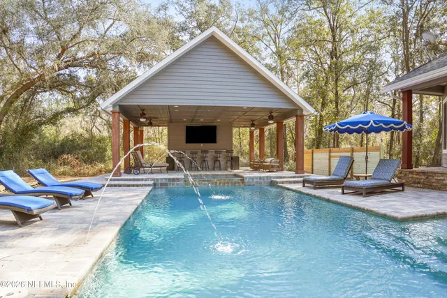 a bedroom with a bed and a table in it