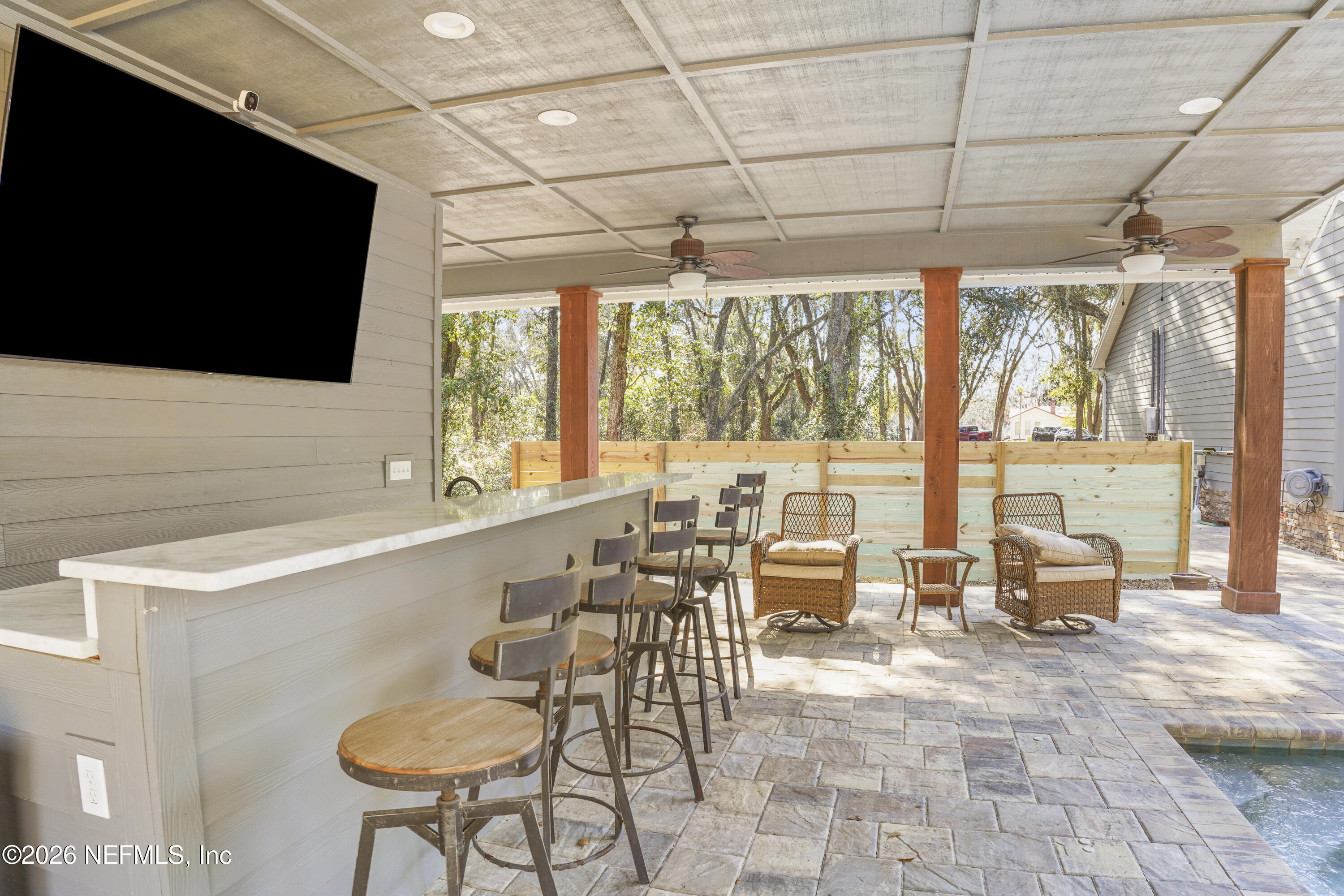 6153 Tim Crews Road Macclenny, FL 32063 - Photo 30 of 79 a living room with patio furniture and a flat screen tv
