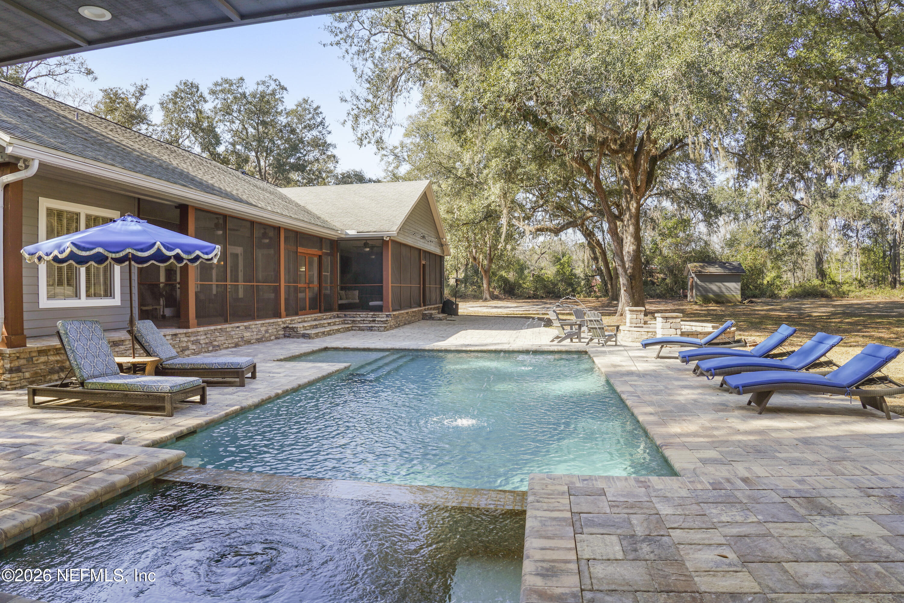 6153 Tim Crews Road Macclenny, FL 32063 - Photo 31 of 79 a view of a patio with chairs and tables