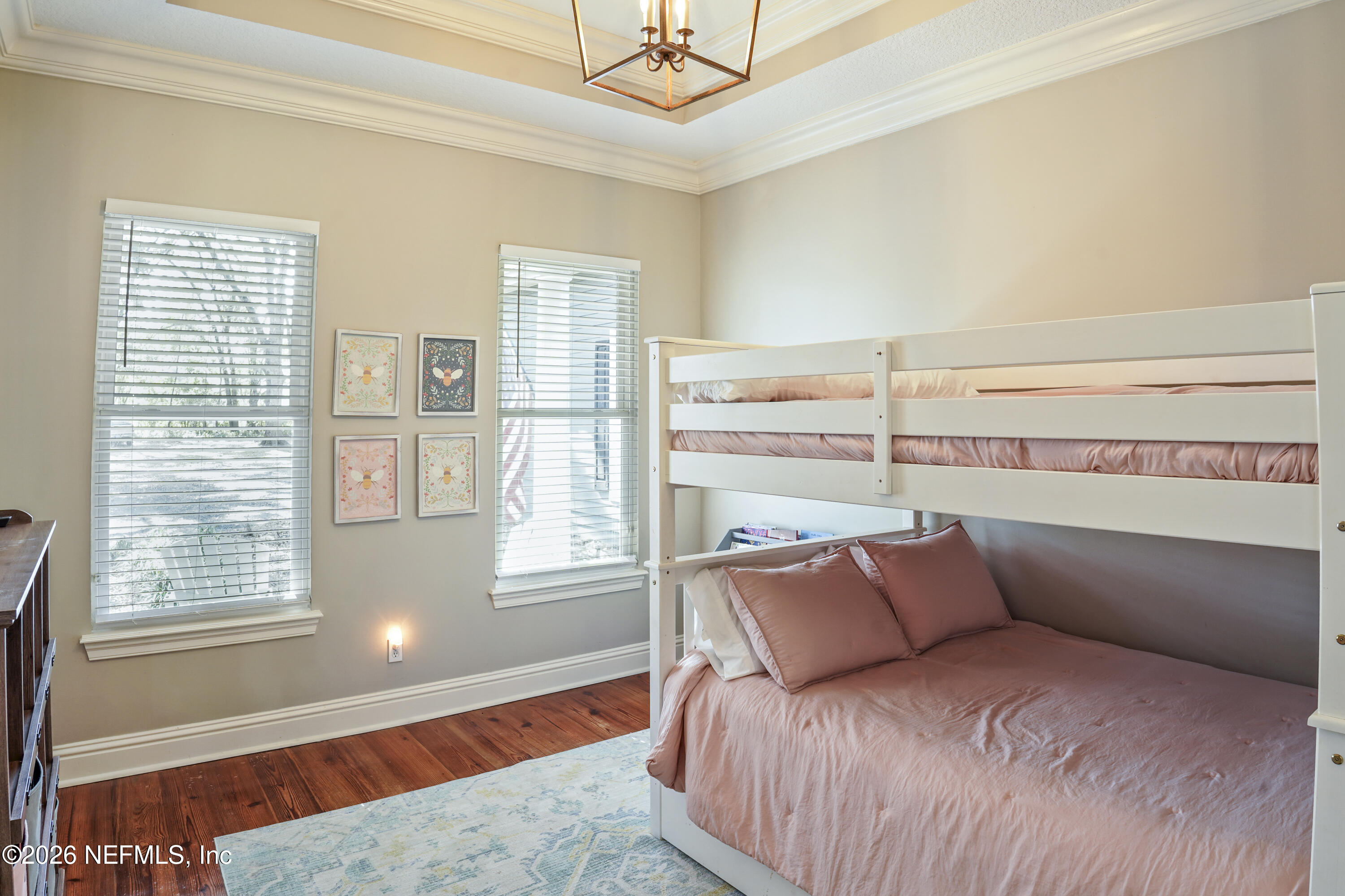 6153 Tim Crews Road Macclenny, FL 32063 - Photo 47 of 79 a bed sitting in a bedroom next to a window