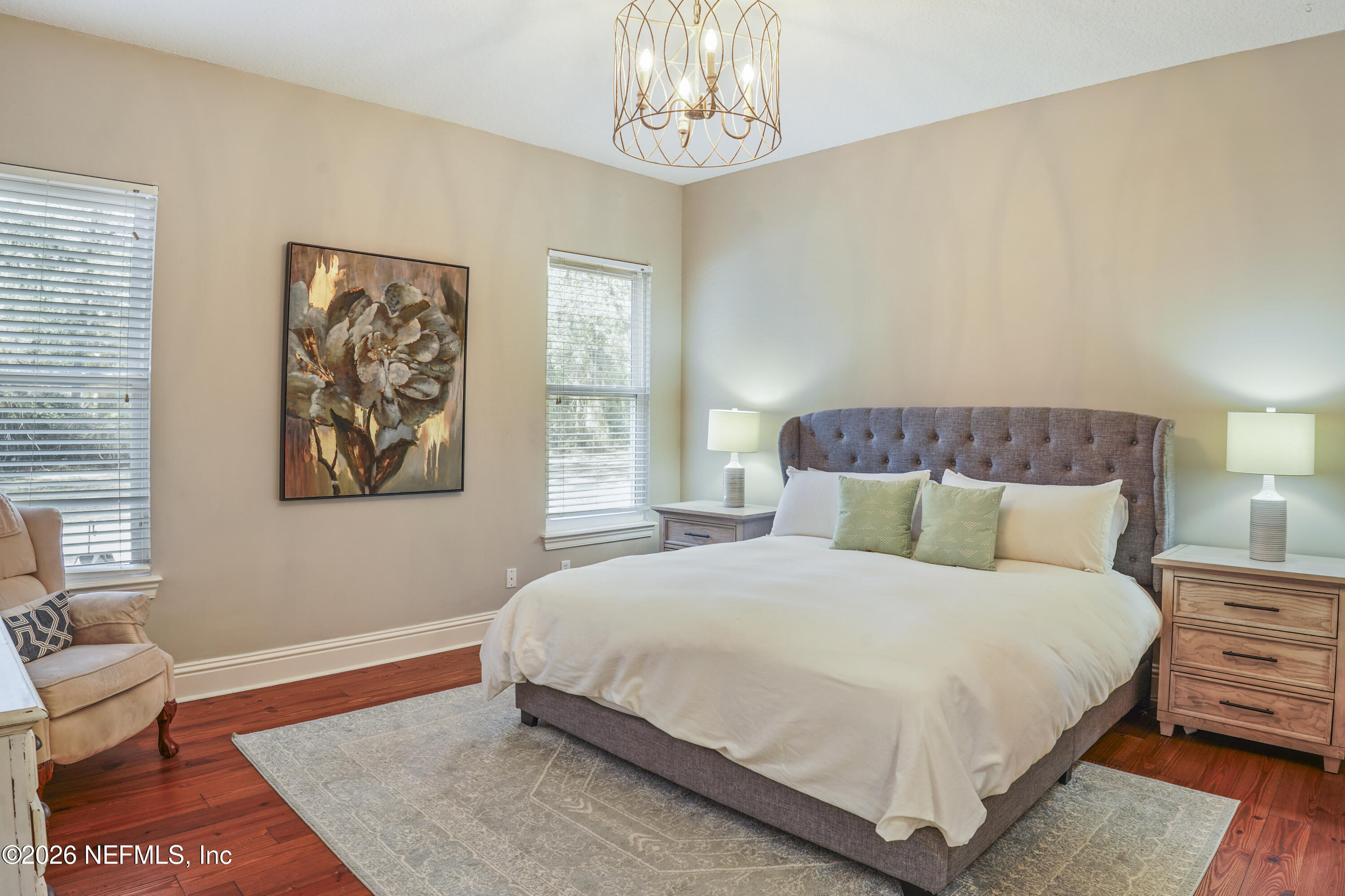 6153 Tim Crews Road Macclenny, FL 32063 - Photo 48 of 79 a bedroom with a bed and a table in it