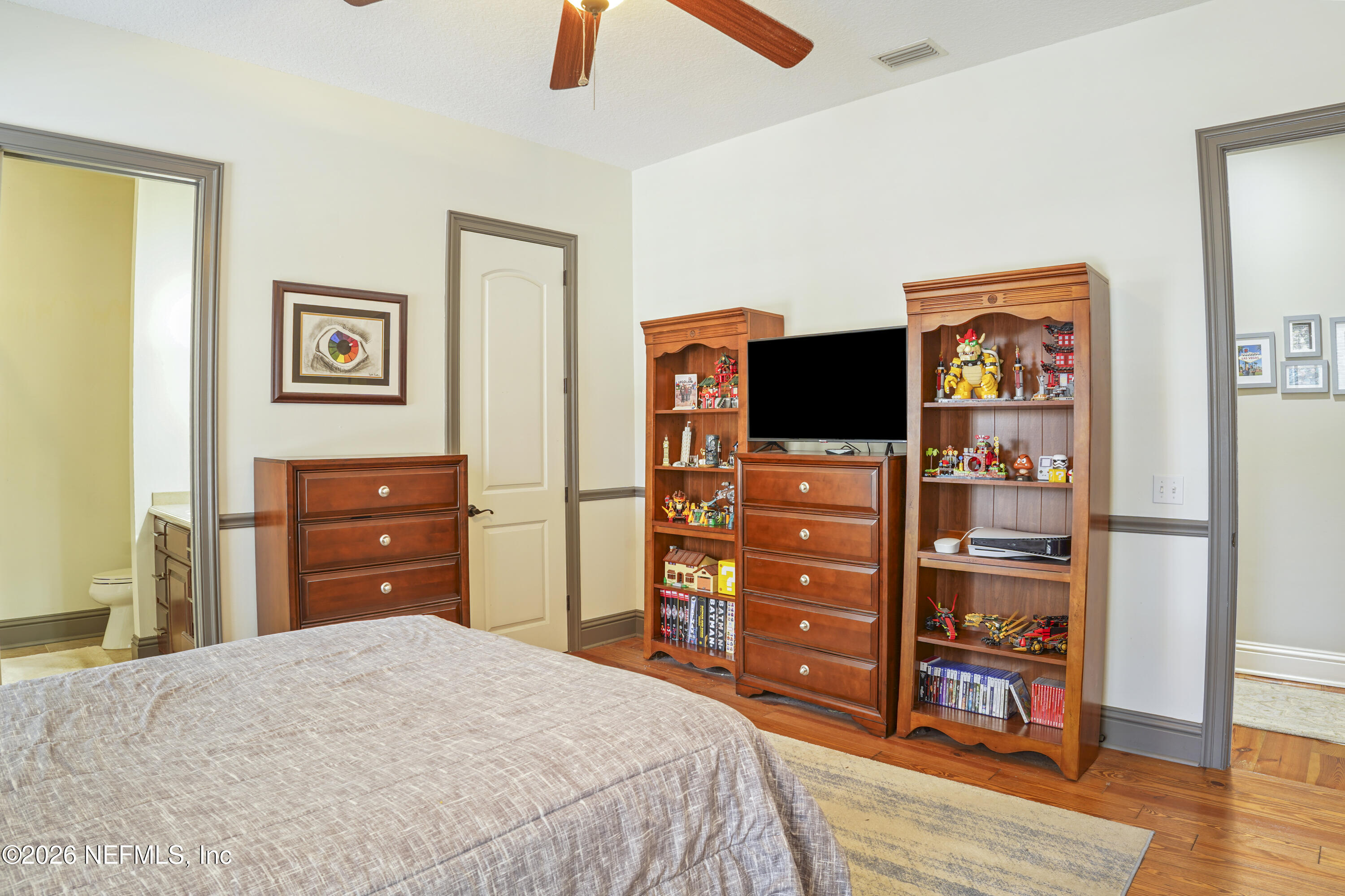 6153 Tim Crews Road Macclenny, FL 32063 - Photo 53 of 79 a bedroom with a bed and a television
