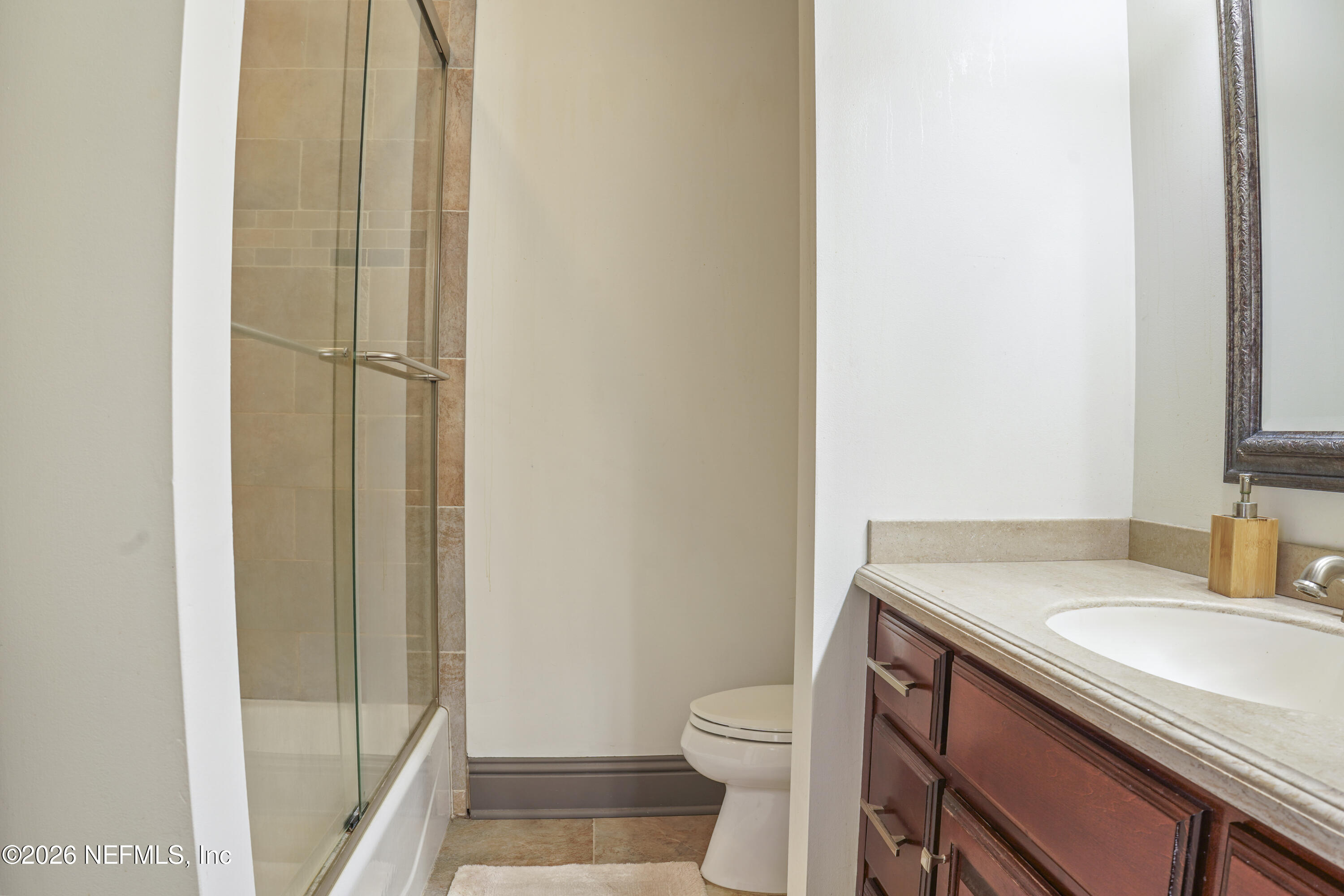 6153 Tim Crews Road Macclenny, FL 32063 - Photo 54 of 79 a bathroom with a sink a toilet and shower