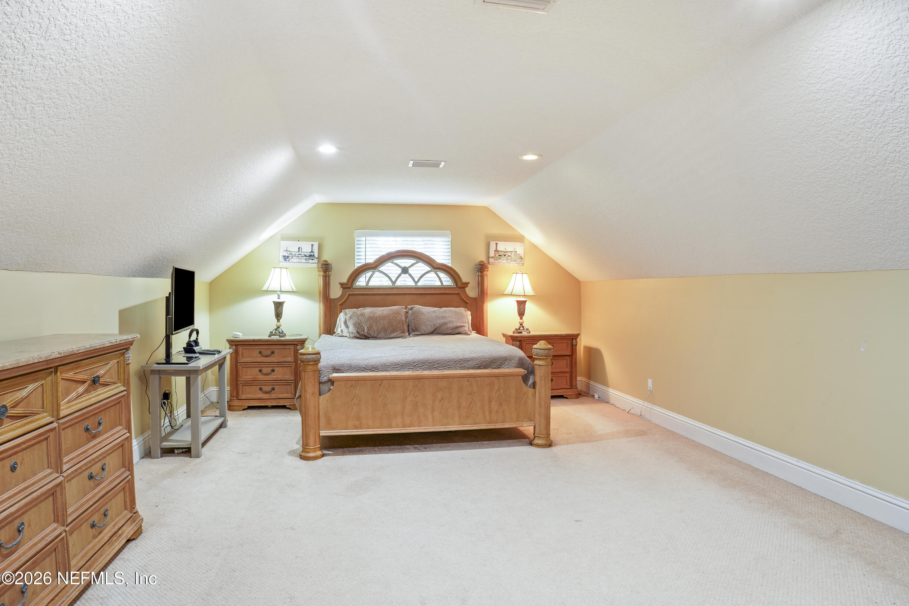 6153 Tim Crews Road Macclenny, FL 32063 - Photo 56 of 79 a spacious bedroom with a bed and a cabinets