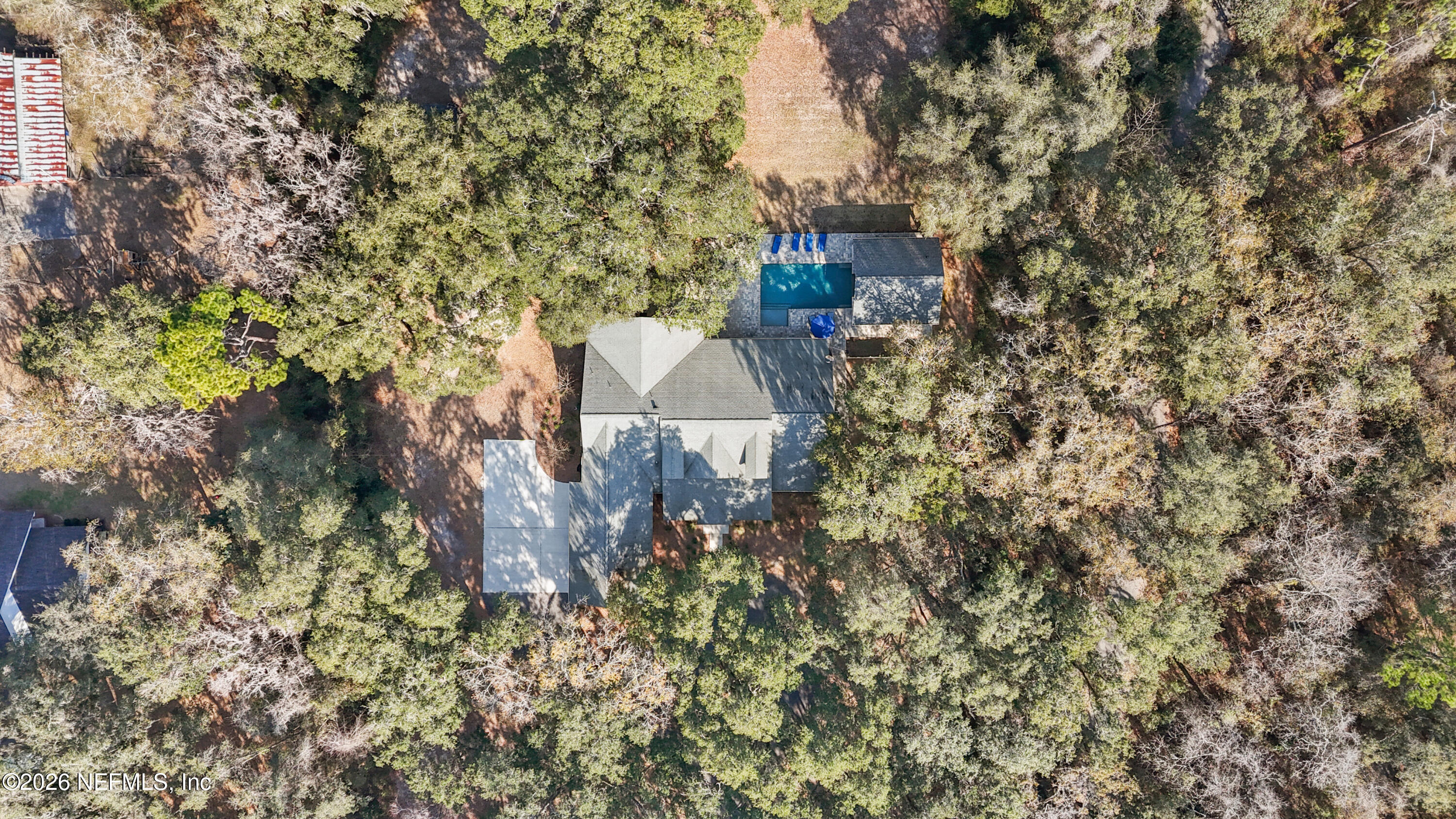 6153 Tim Crews Road Macclenny, FL 32063 - Photo 6 of 79 a aerial view of a house with a yard and large trees