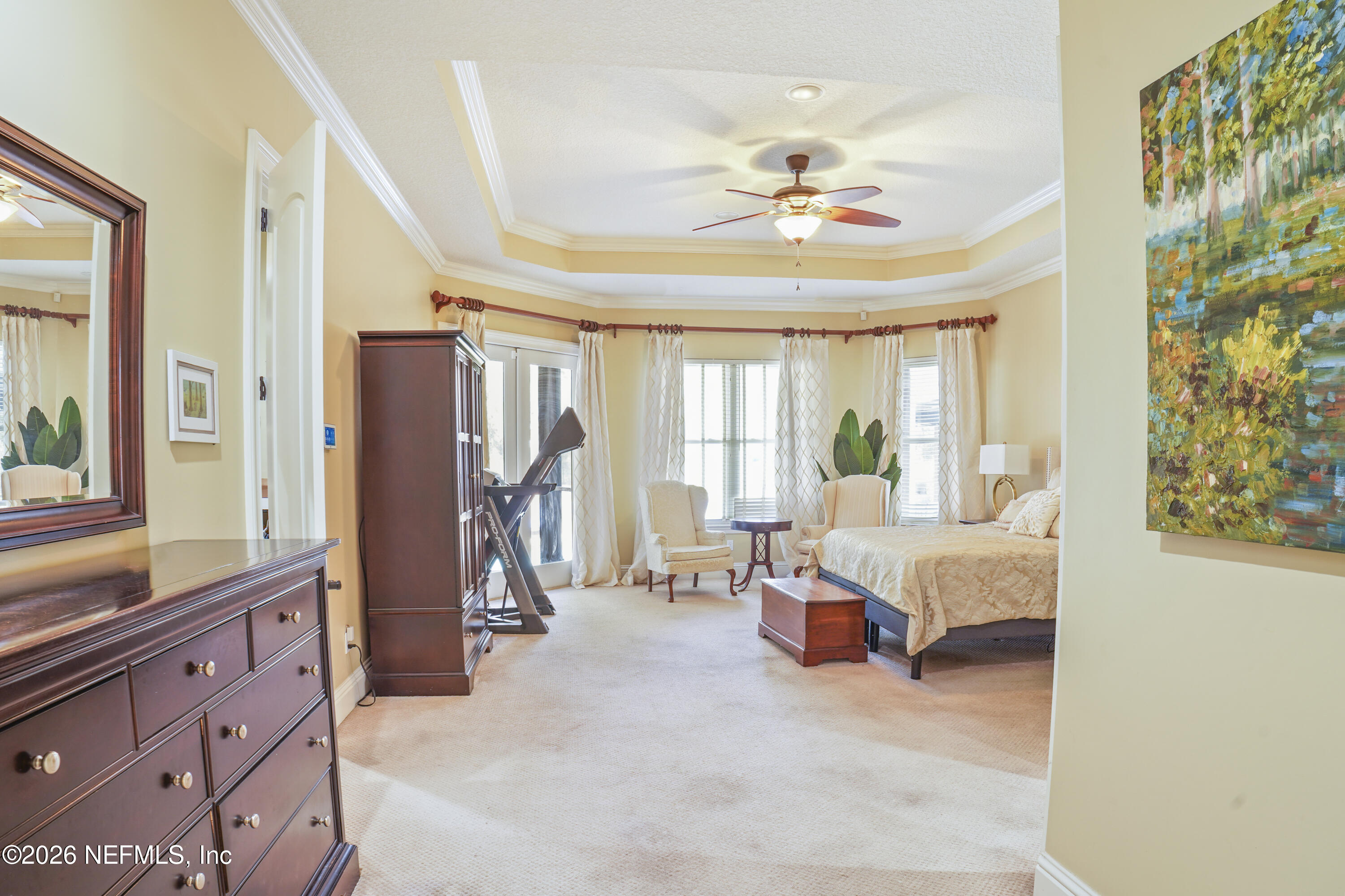 6153 Tim Crews Road Macclenny, FL 32063 - Photo 64 of 79 a living room with furniture a chandelier and a flat screen tv
