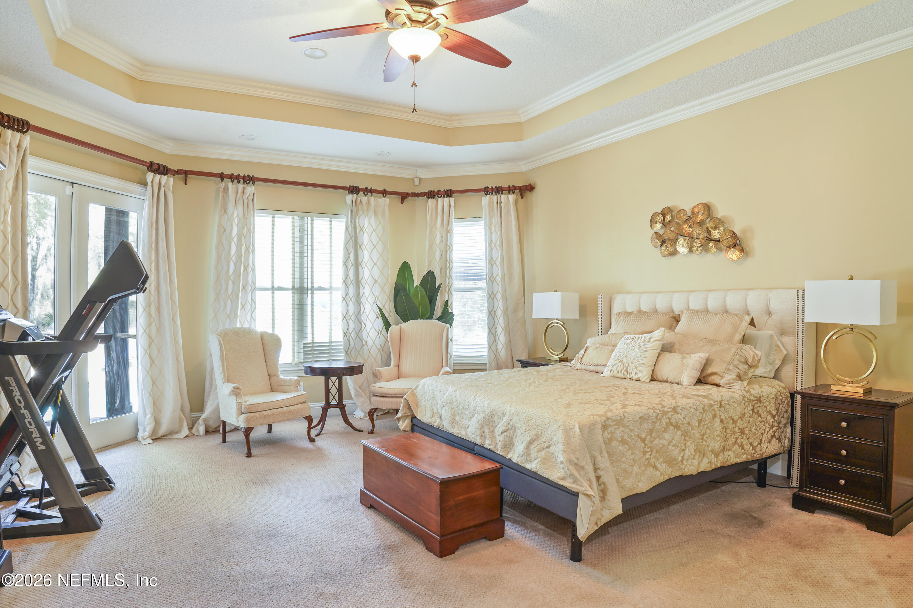 6153 Tim Crews Road Macclenny, FL 32063 - Photo 65 of 79 a bedroom with a bed gym equipment and a large window