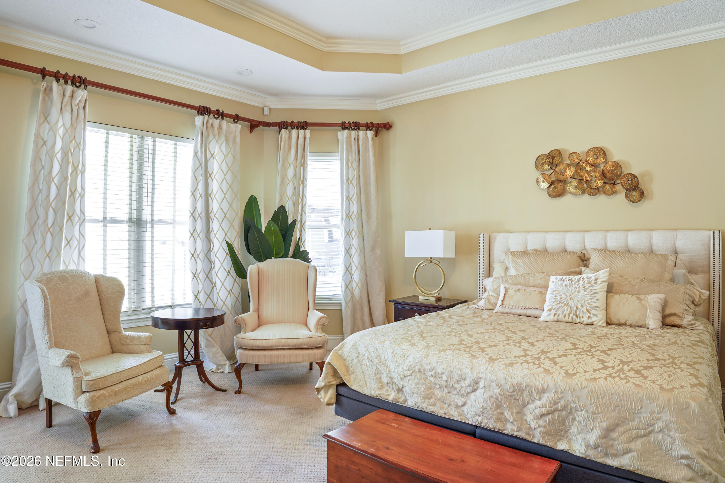 6153 Tim Crews Road Macclenny, FL 32063 - Photo 66 of 79 a bedroom with a bed and a chair