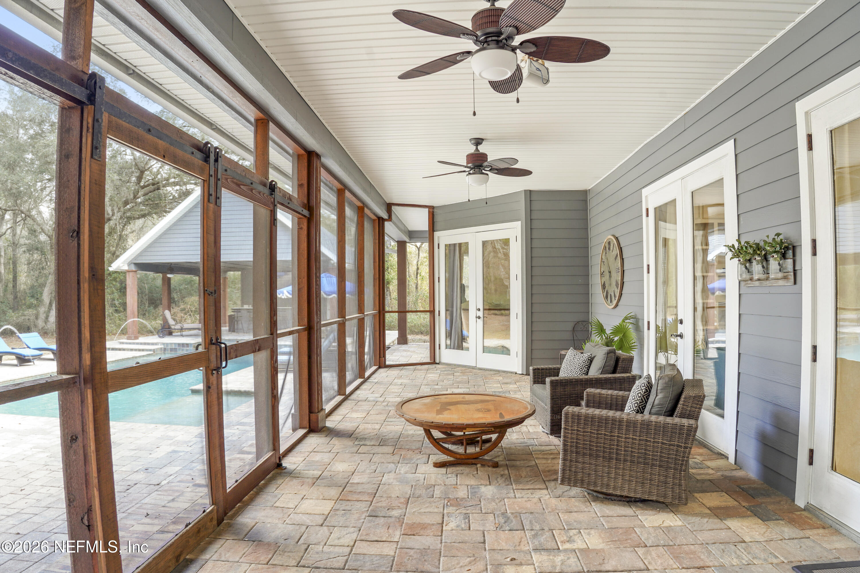 6153 Tim Crews Road Macclenny, FL 32063 - Photo 76 of 79 a living room with furniture and a floor to ceiling window