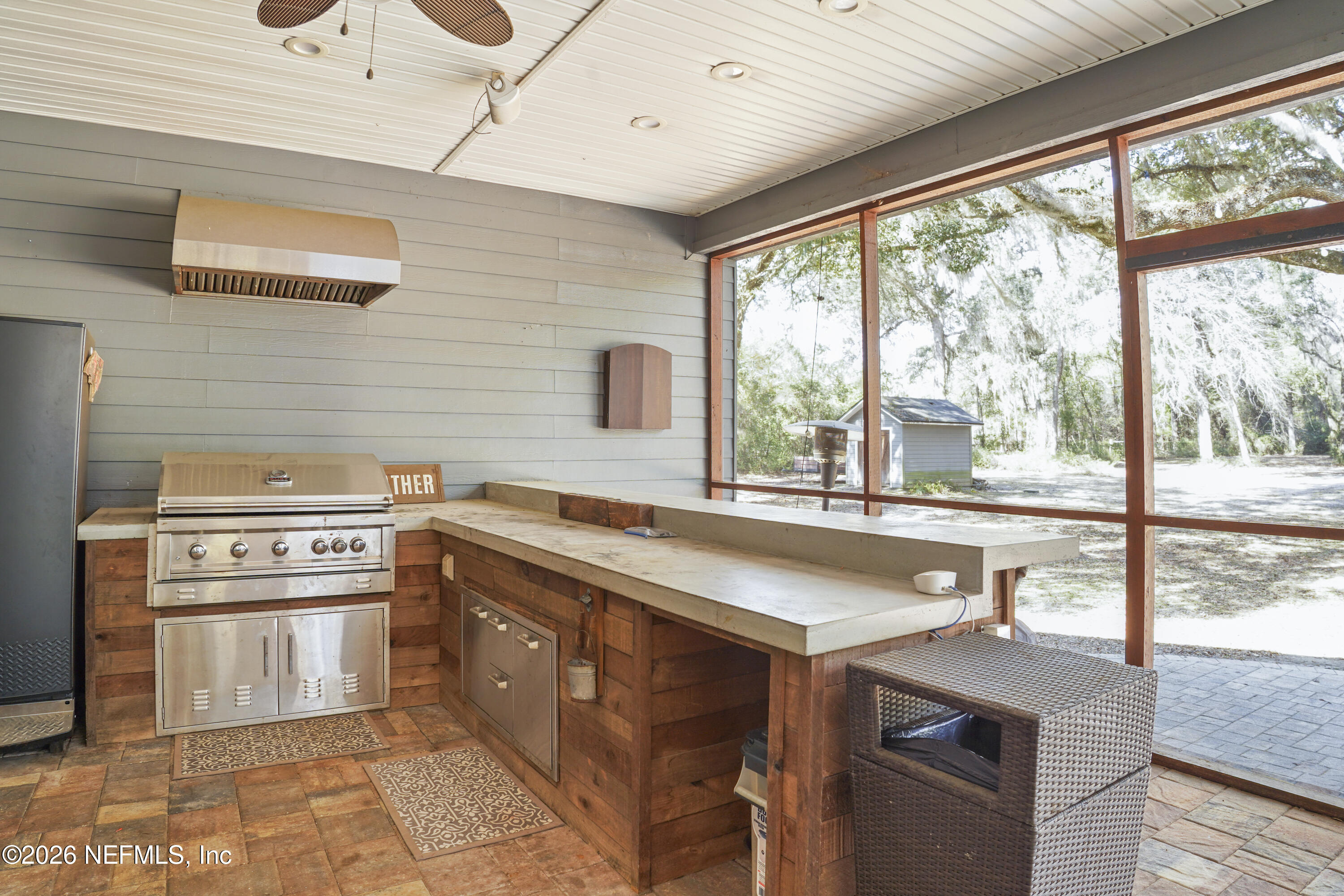 6153 Tim Crews Road Macclenny, FL 32063 - Photo 78 of 79 a kitchen with a stove a sink and a refrigerator