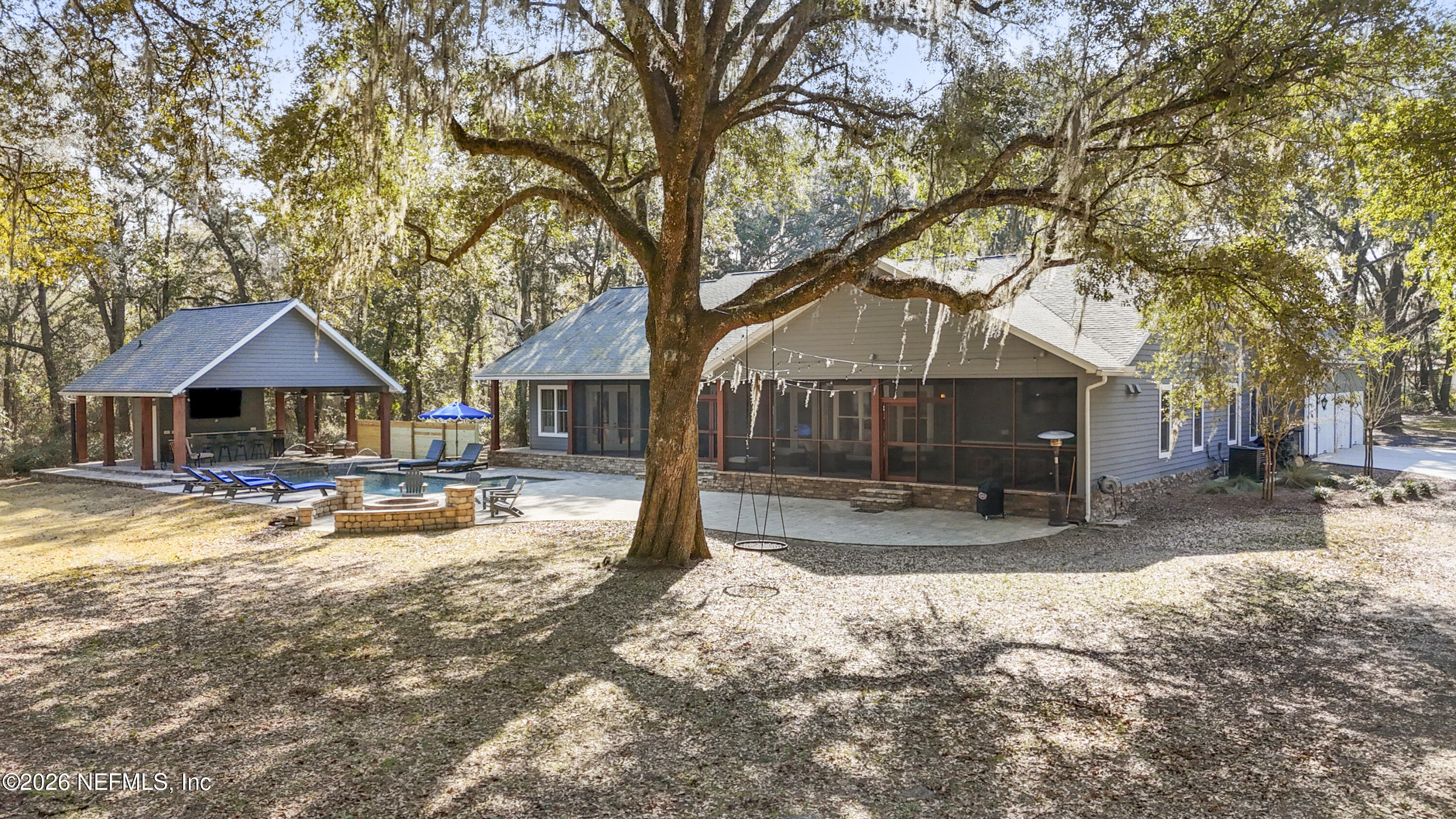 6153 Tim Crews Road Macclenny, FL 32063 - Photo 8 of 79 a view of a house with a yard covered in snow