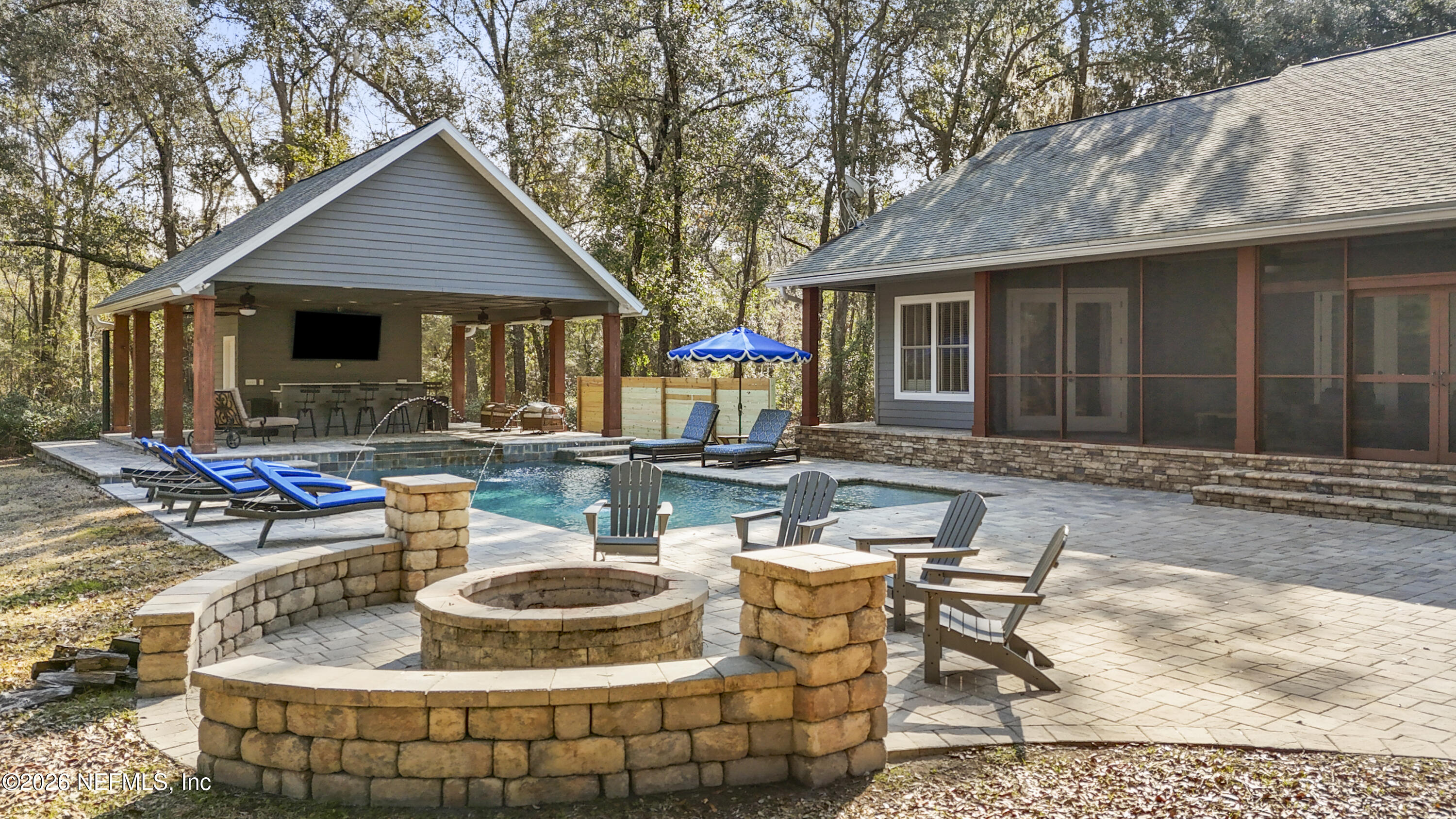 6153 Tim Crews Road Macclenny, FL 32063 - Photo 9 of 79 a view of a house with backyard fountain and sitting area