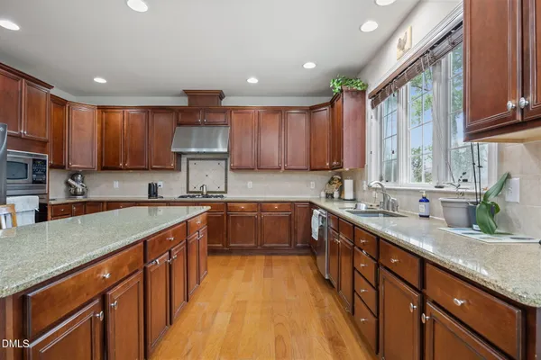 a living room with furniture and a lamp