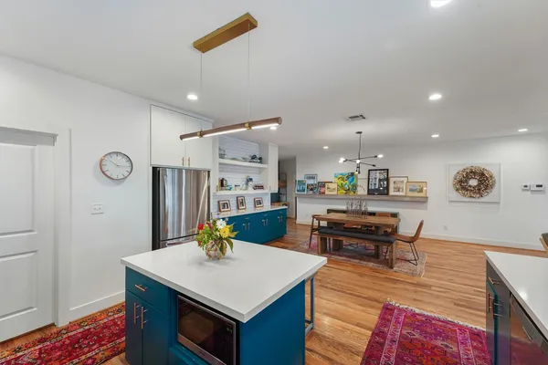 a view of kitchen island with furniture and wooden floor