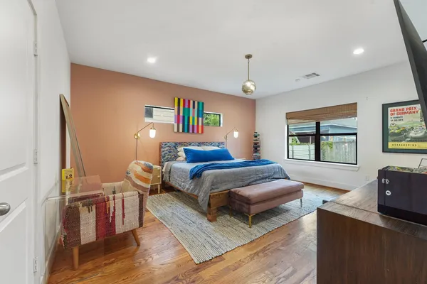 a bedroom with furniture and a window