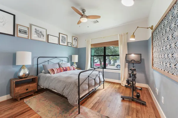 a view of walk in closet with clothes