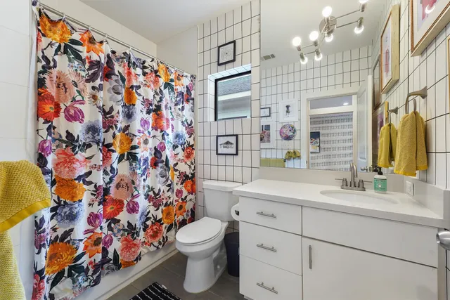 a bedroom with furniture and a rug