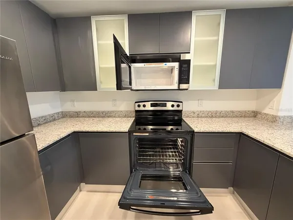 a kitchen with a stove and a sink