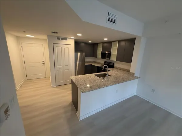 a bathroom with a sink a mirror and shower