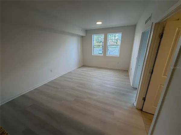 an empty room with windows