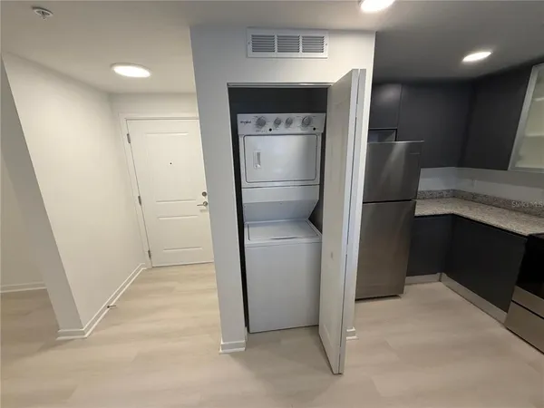 a view of hallway with washer and dryer