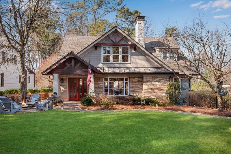 2266 Howell Mill Road Northwest Atlanta, GA 30318 - Photo 1 of 1 a front view of a house with a yard