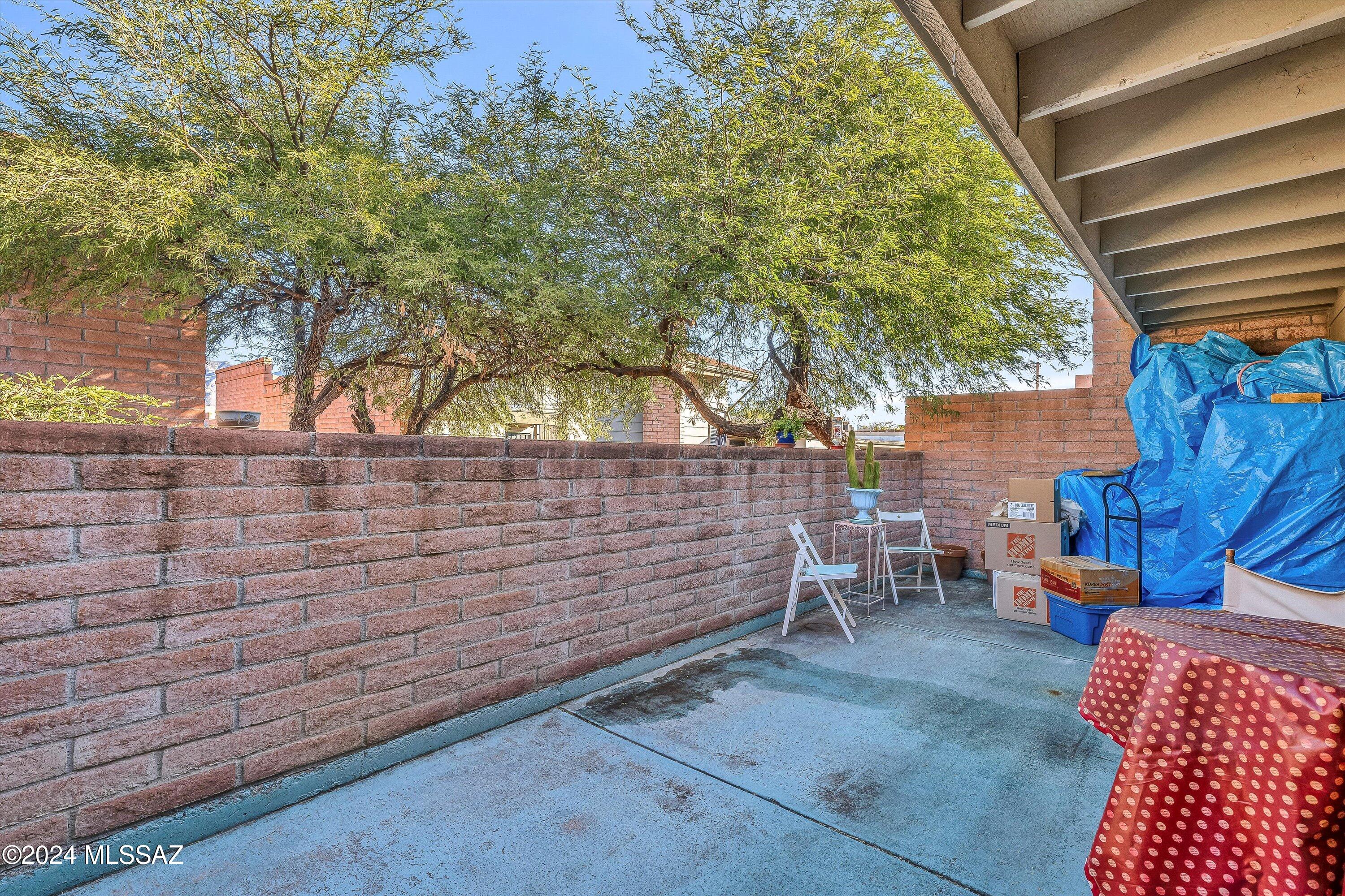 4309 East Presidio Road Tucson, AZ 85712 - Photo 24 of 28 a backyard of a house with table and chairs
