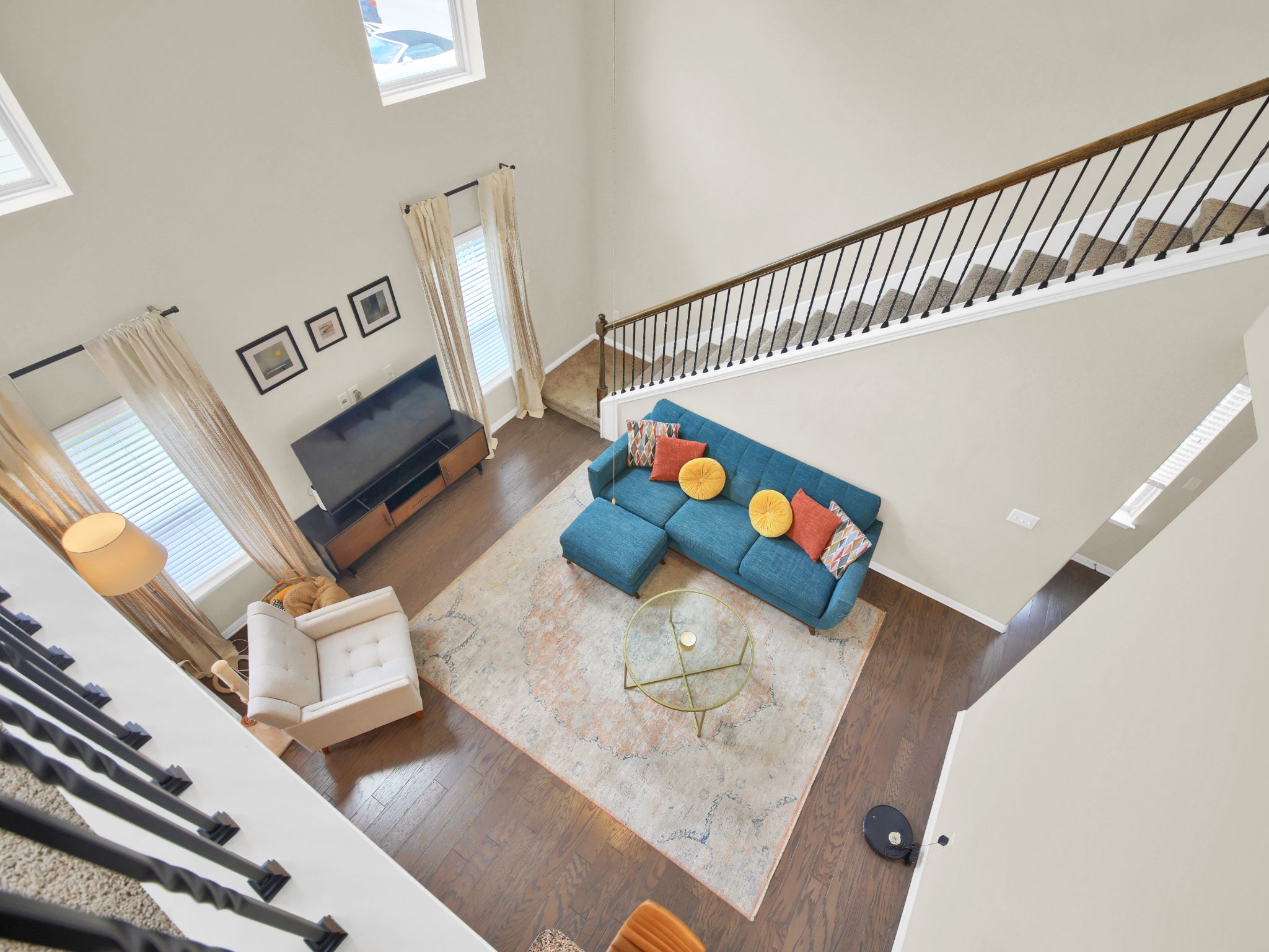 1600 Airedale Road, Unit 2601 Austin, TX 78748 - Photo 18 of 26 An airy living area offers double-height ceilings and a grand staircase.