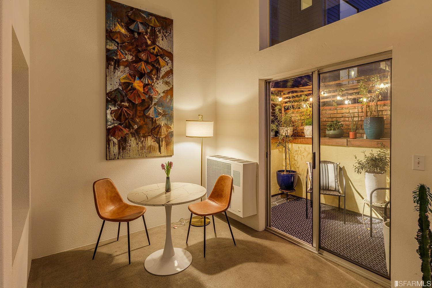 728 Alabama Street, Unit 205 San Francisco, CA 94110 - Photo 11 of 19 a dining room with furniture and a floor to ceiling window