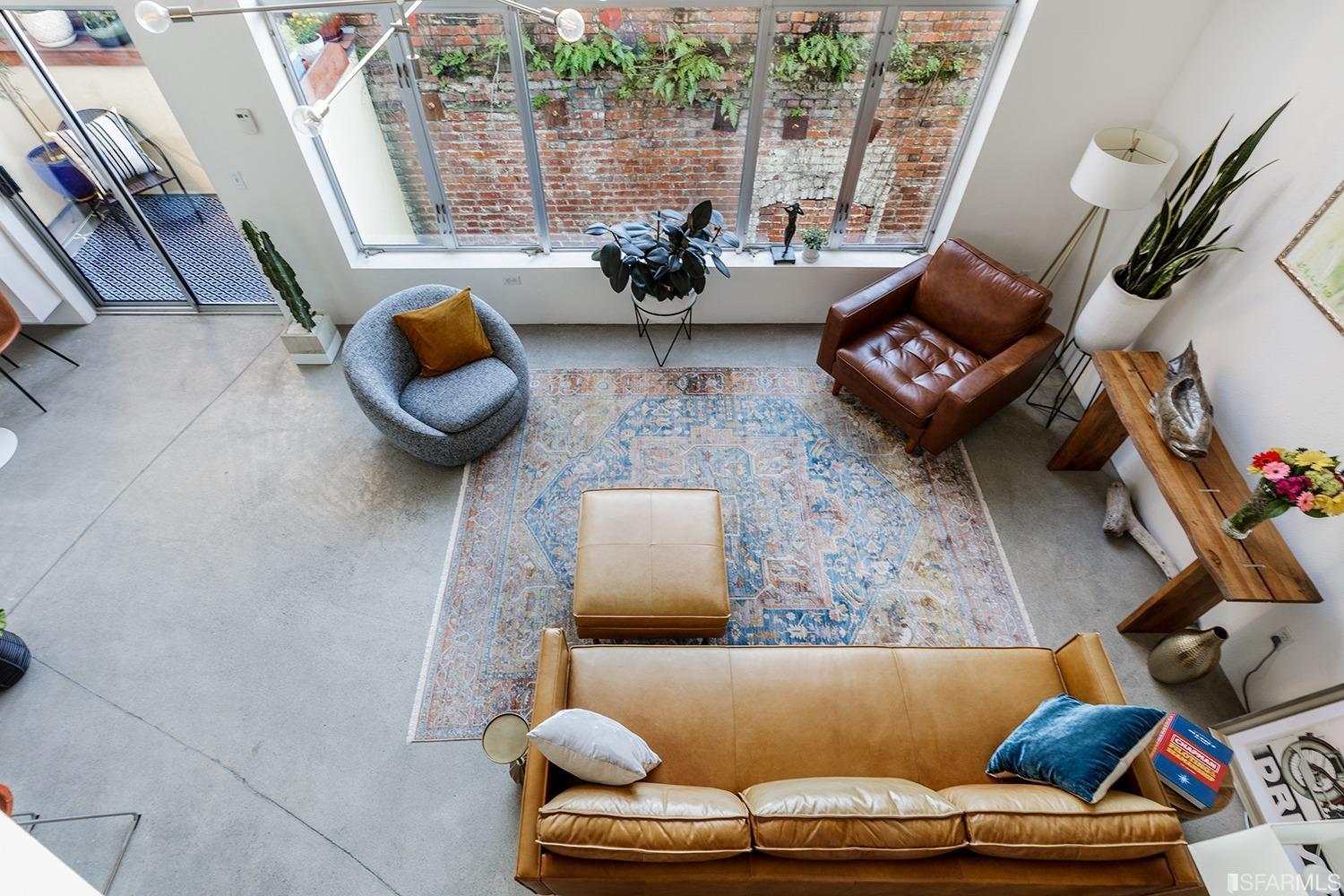 728 Alabama Street, Unit 205 San Francisco, CA 94110 - Photo 17 of 19 a living room with furniture and a fireplace