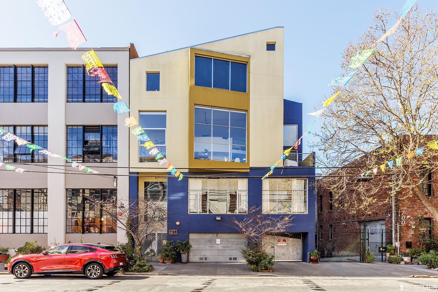 728 Alabama Street, Unit 205 San Francisco, CA 94110 - Photo 19 of 19 a front view of a residential apartment building with a yard