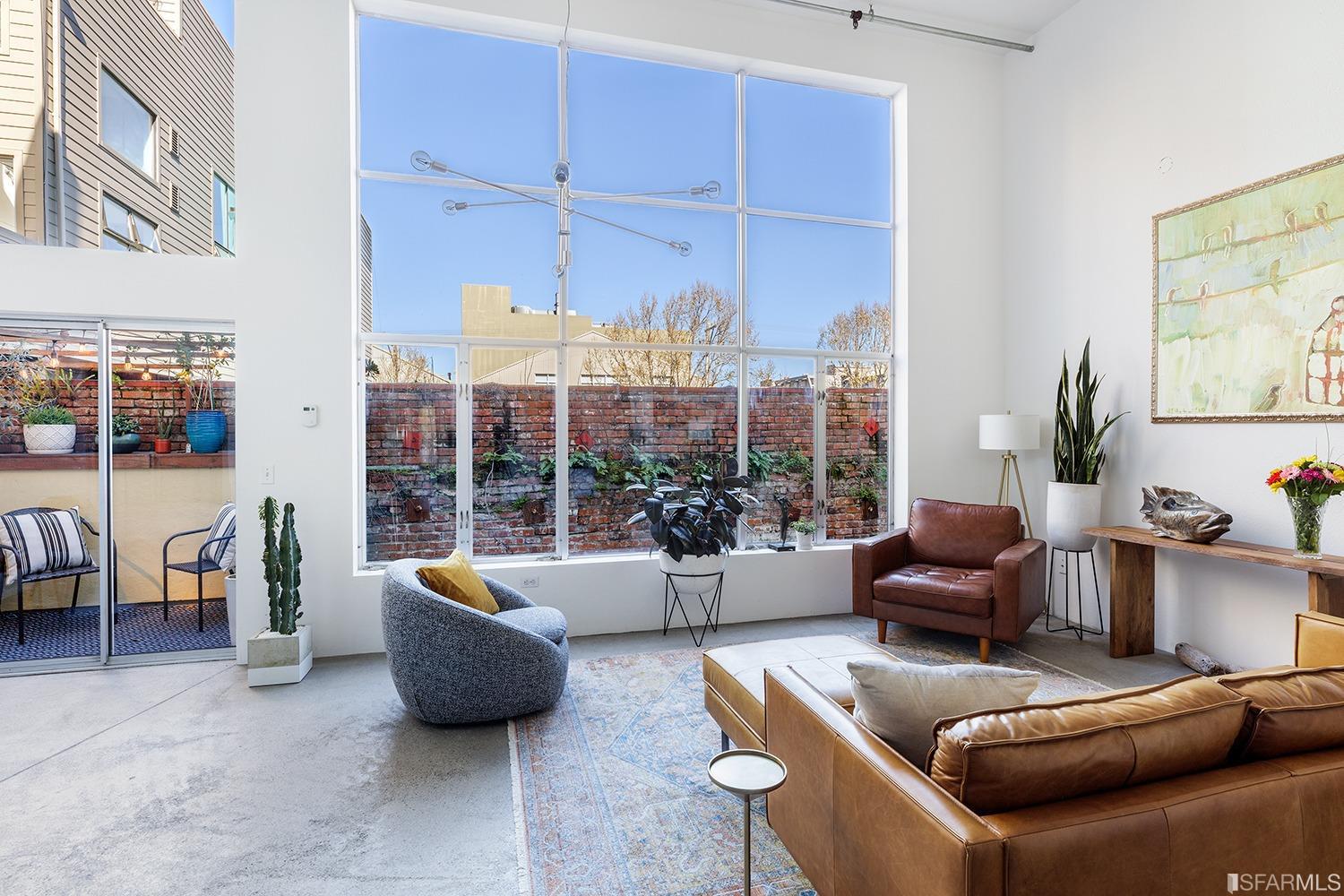 728 Alabama Street, Unit 205 San Francisco, CA 94110 - Photo 3 of 19 a living room with furniture and a large window