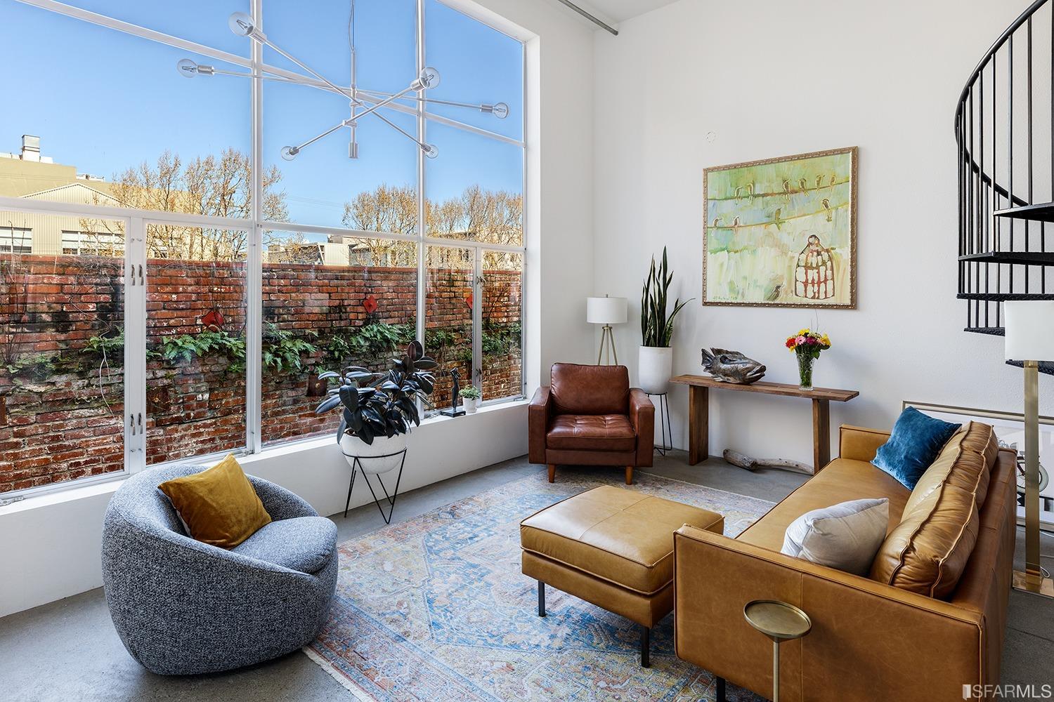 728 Alabama Street, Unit 205 San Francisco, CA 94110 - Photo 4 of 19 a living room with furniture and a large window