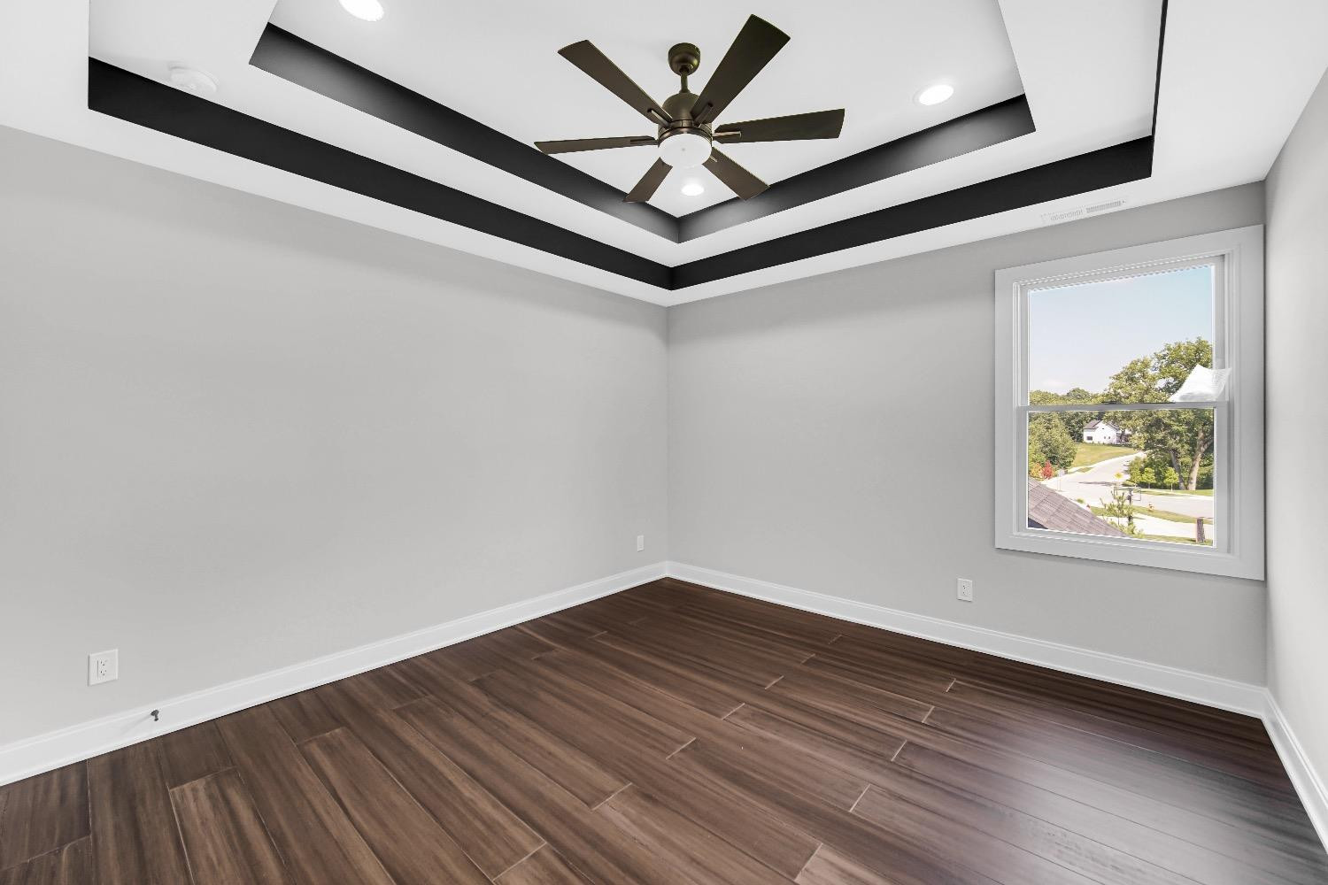 11039 Macedon Street Winfield, IN 46307 - Photo 24 of 36 a view of an empty room with window and wooden floor